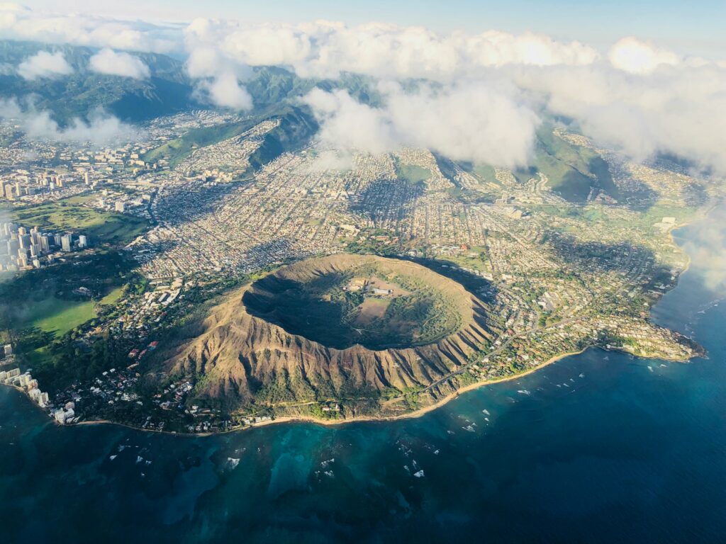 aerial view of a volcano and a body of water