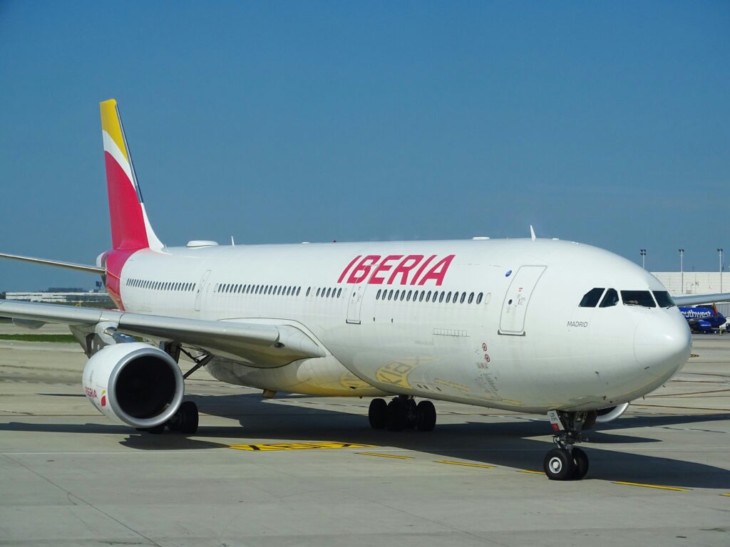 a large white airplane on a runway