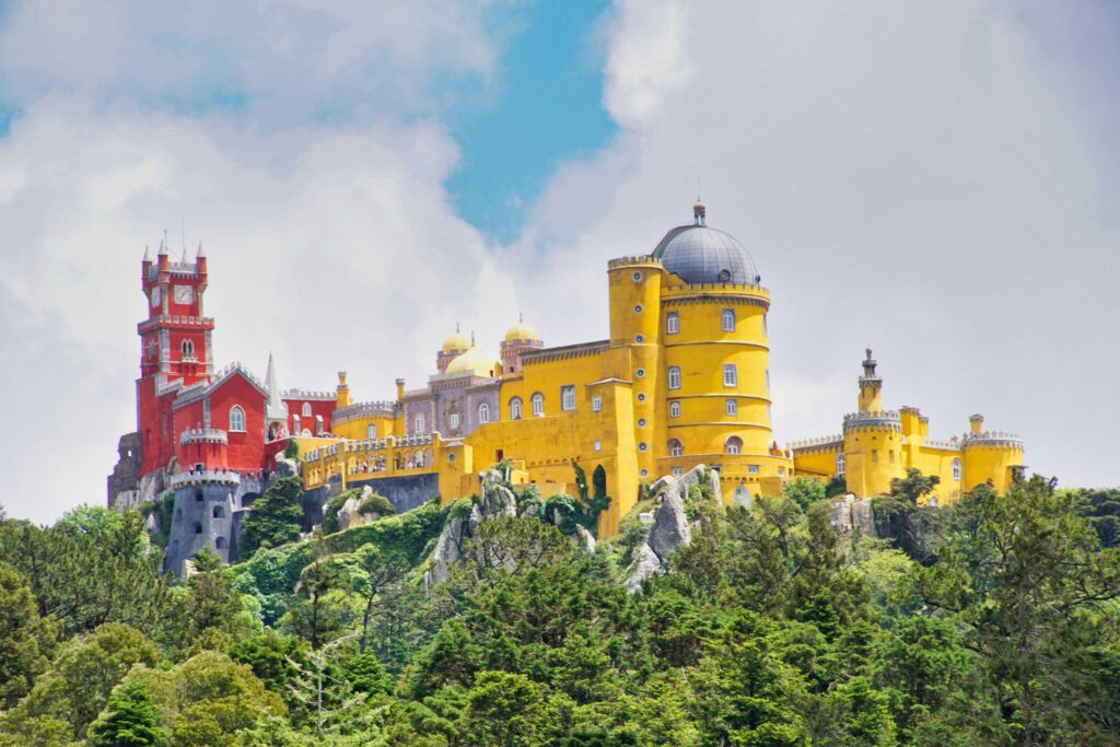a yellow building on a hill