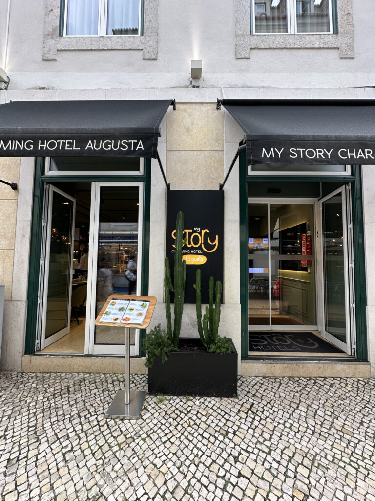a building with black awnings and signs