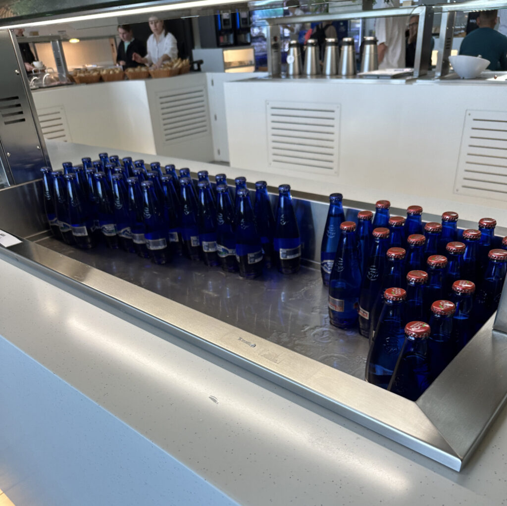 a group of blue bottles on a counter