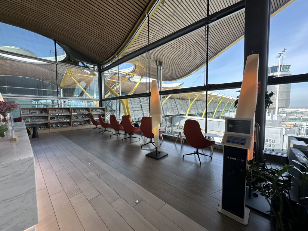 a room with chairs and a large window
