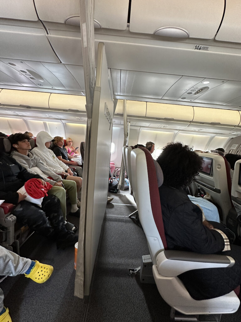 a group of people sitting in an airplane
