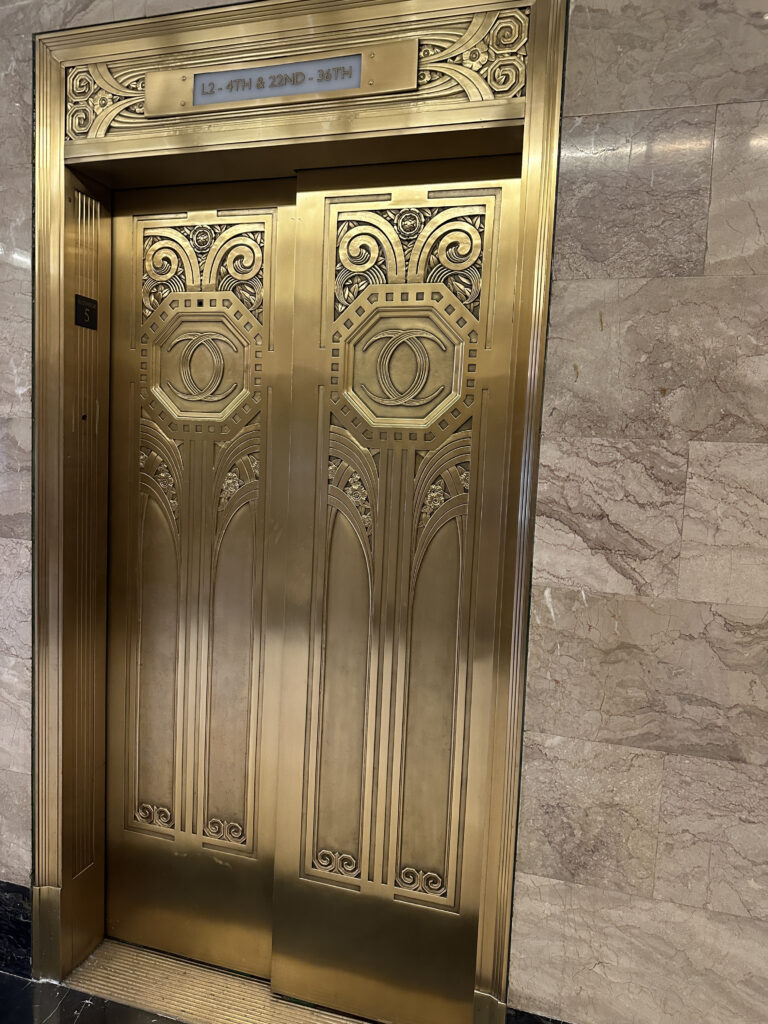 a gold elevator doors in a building