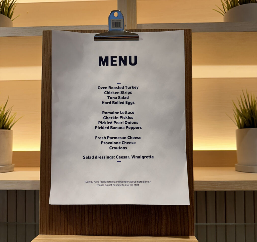 a menu on a wooden board