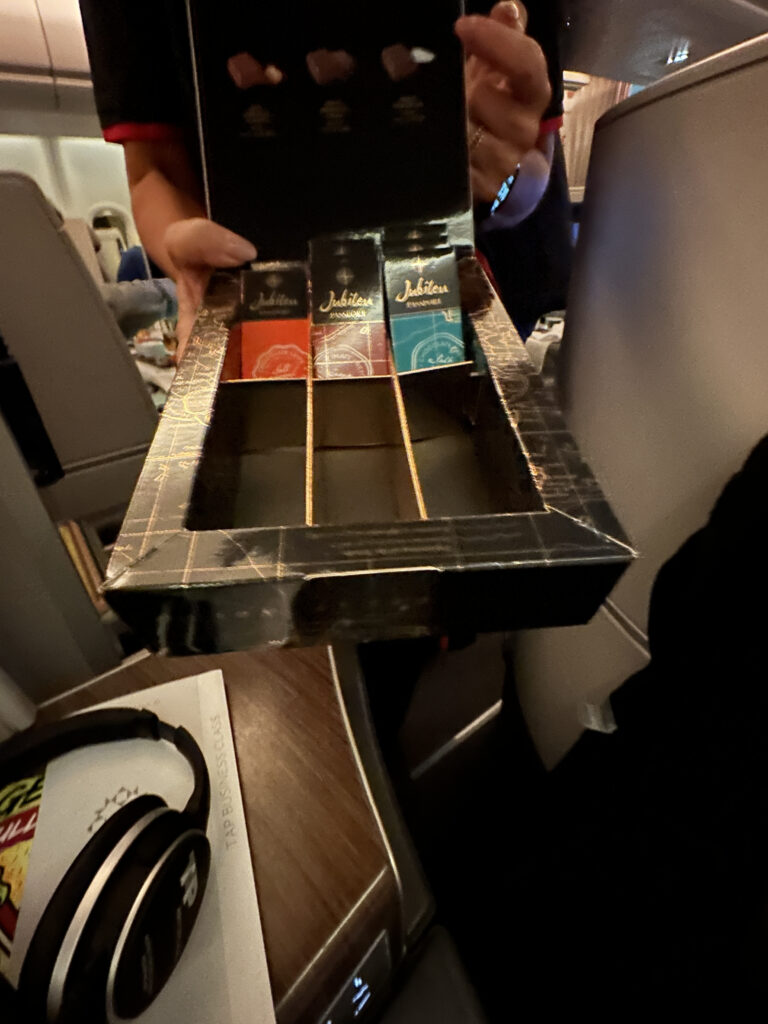 a hand holding a box with a few small boxes