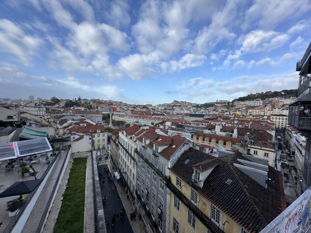 a city with many buildings and a blue sky