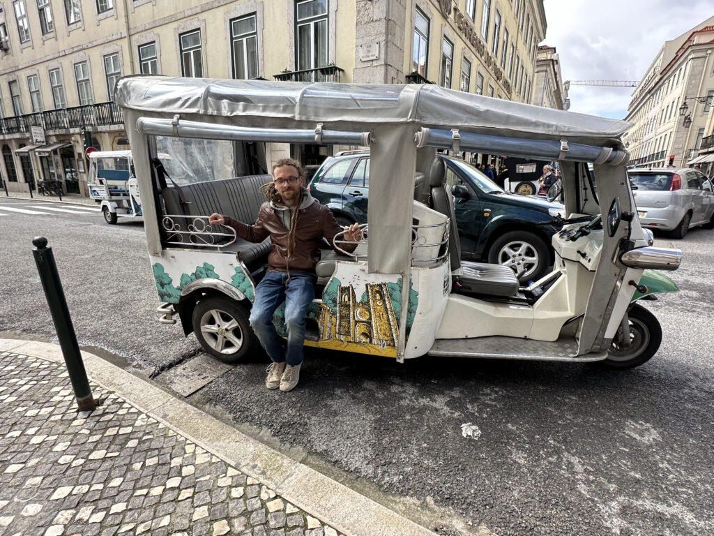 a man sitting on a vehicle