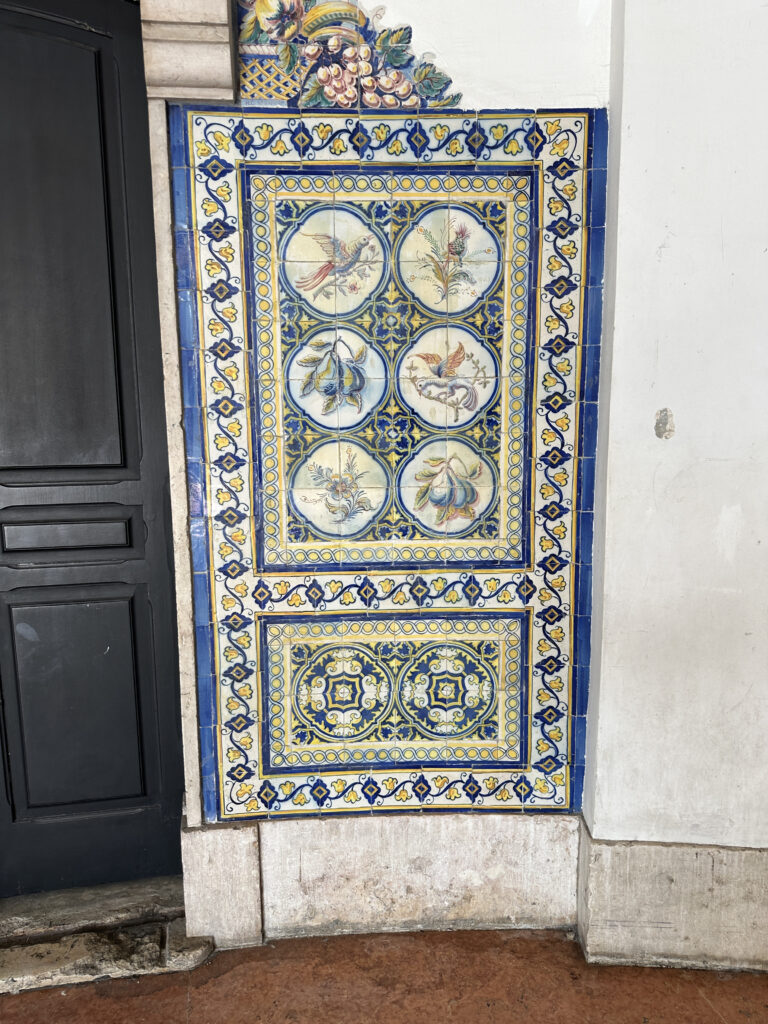 a blue and yellow tile on a wall