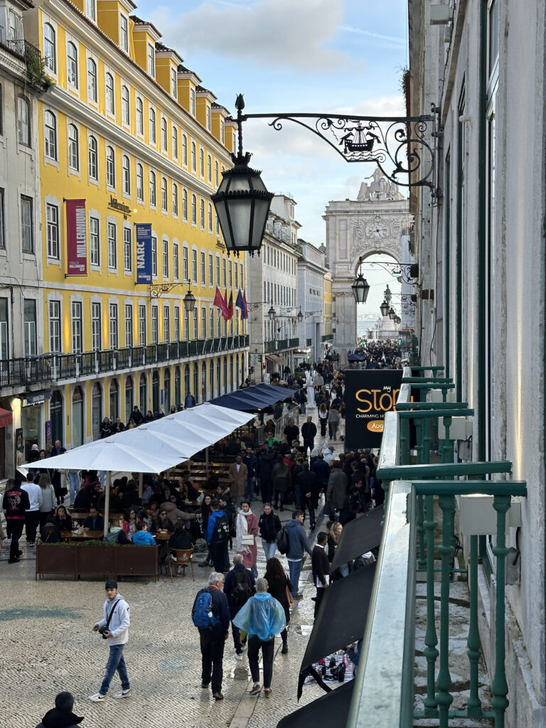 a group of people walking down a street