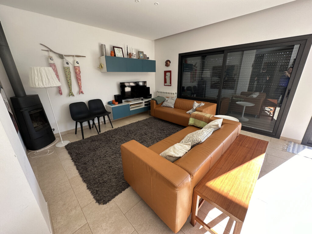 a living room with a couch and a fireplace