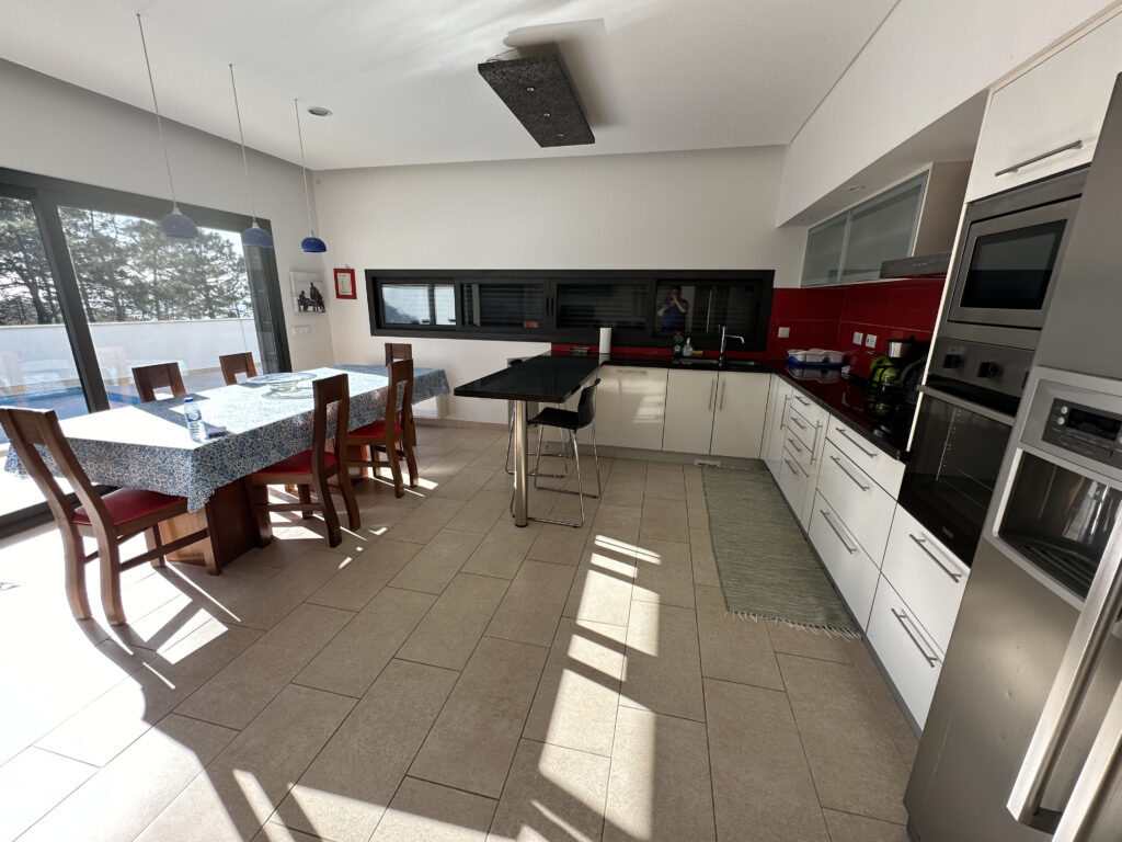 a kitchen with a table and chairs