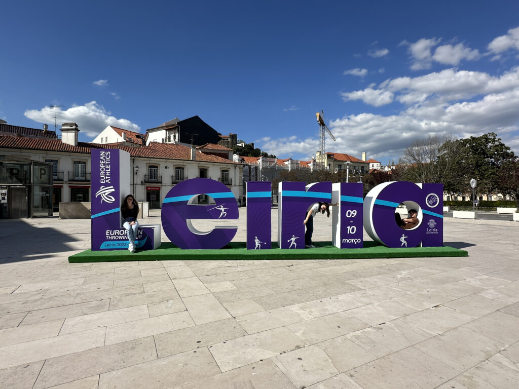a large purple sign with letters on it