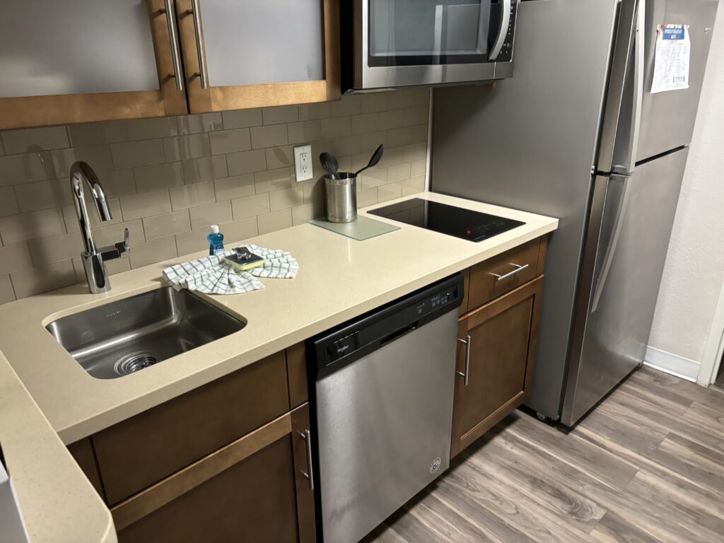 a kitchen with a sink and a microwave