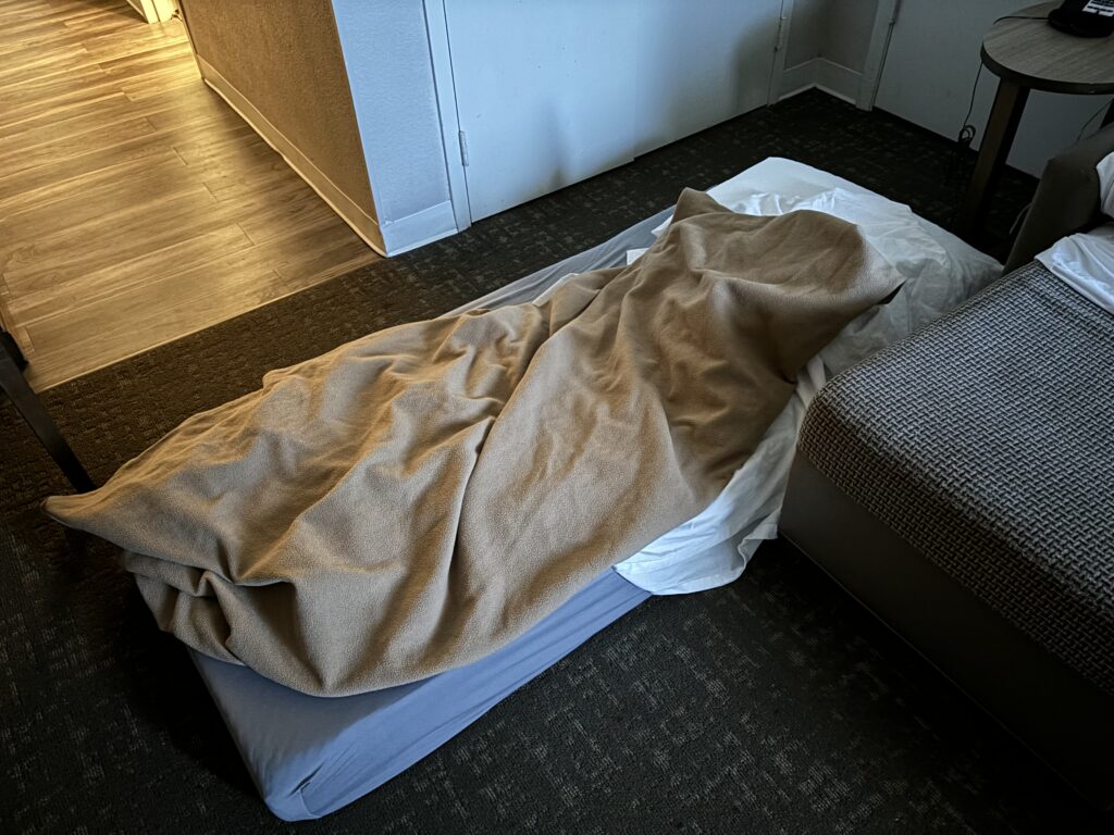 a bed with a blanket on it