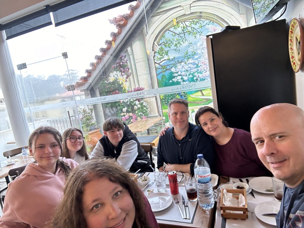 a group of people sitting at a table