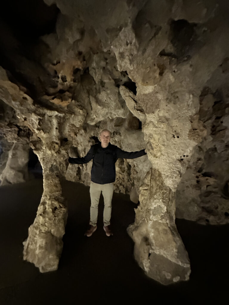 a man standing in a cave