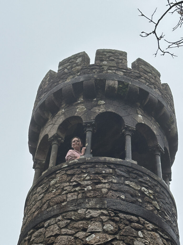 a woman standing in a tower