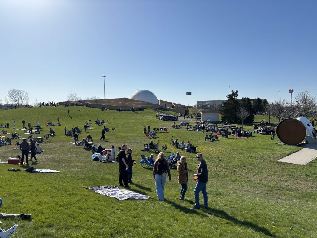 a group of people on a grassy field