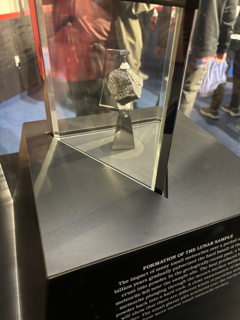 a display case with a silver object in it