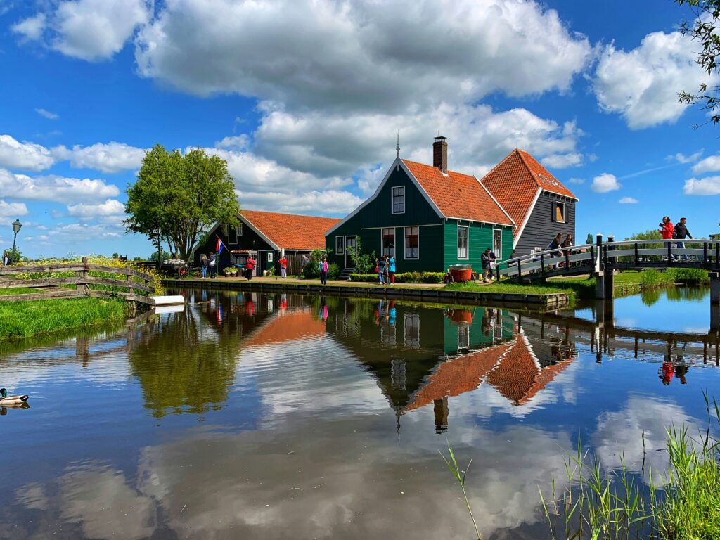 a house next to a body of water