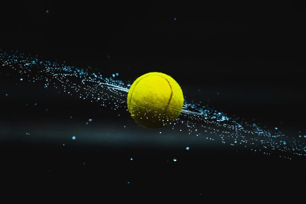 a tennis ball flying through water
