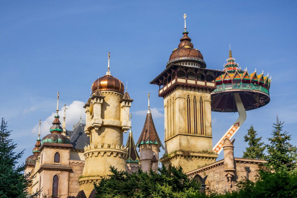 a castle with a roller coaster