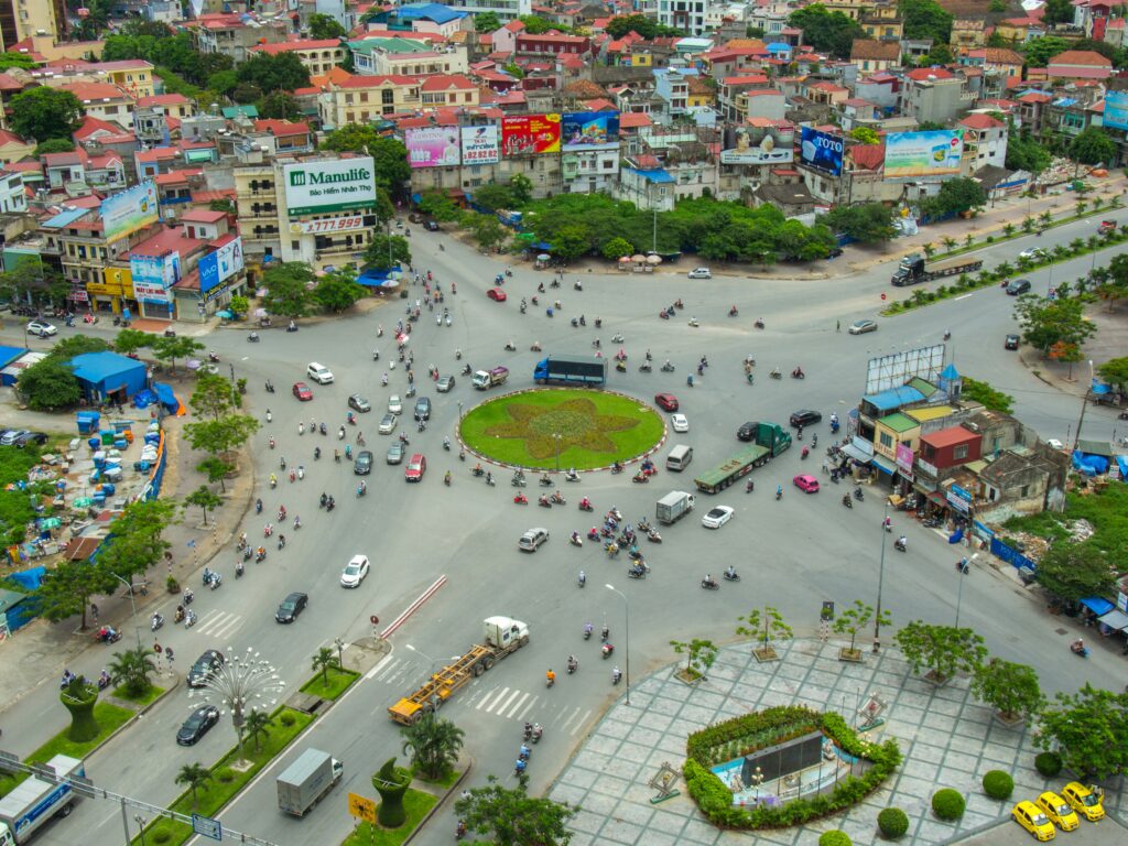 a city with many cars and people