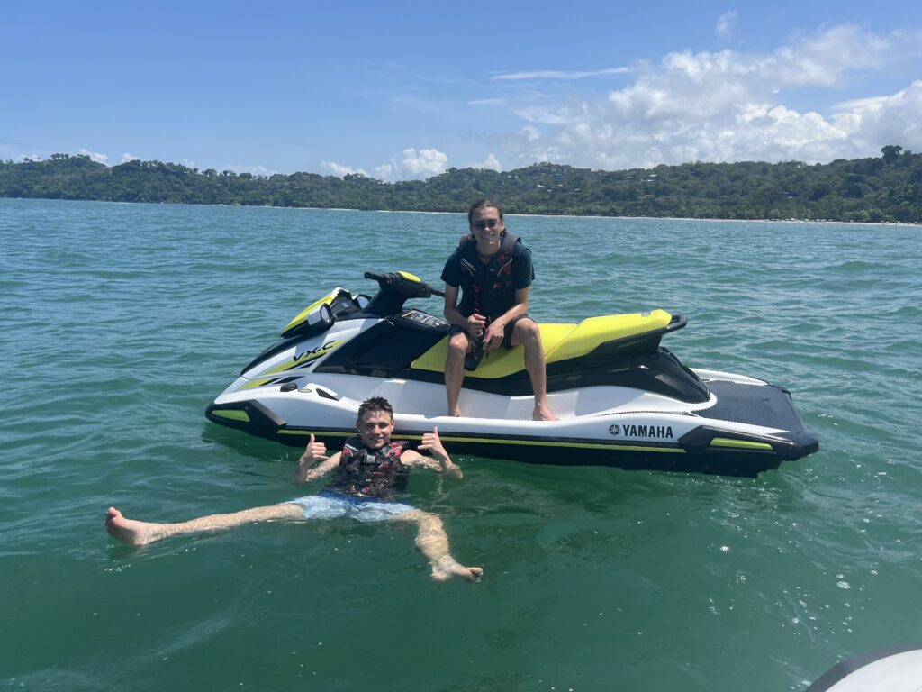two men on a jet ski in the water