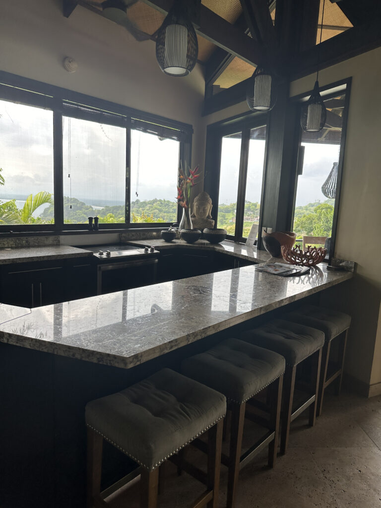 a kitchen with a counter top and stools