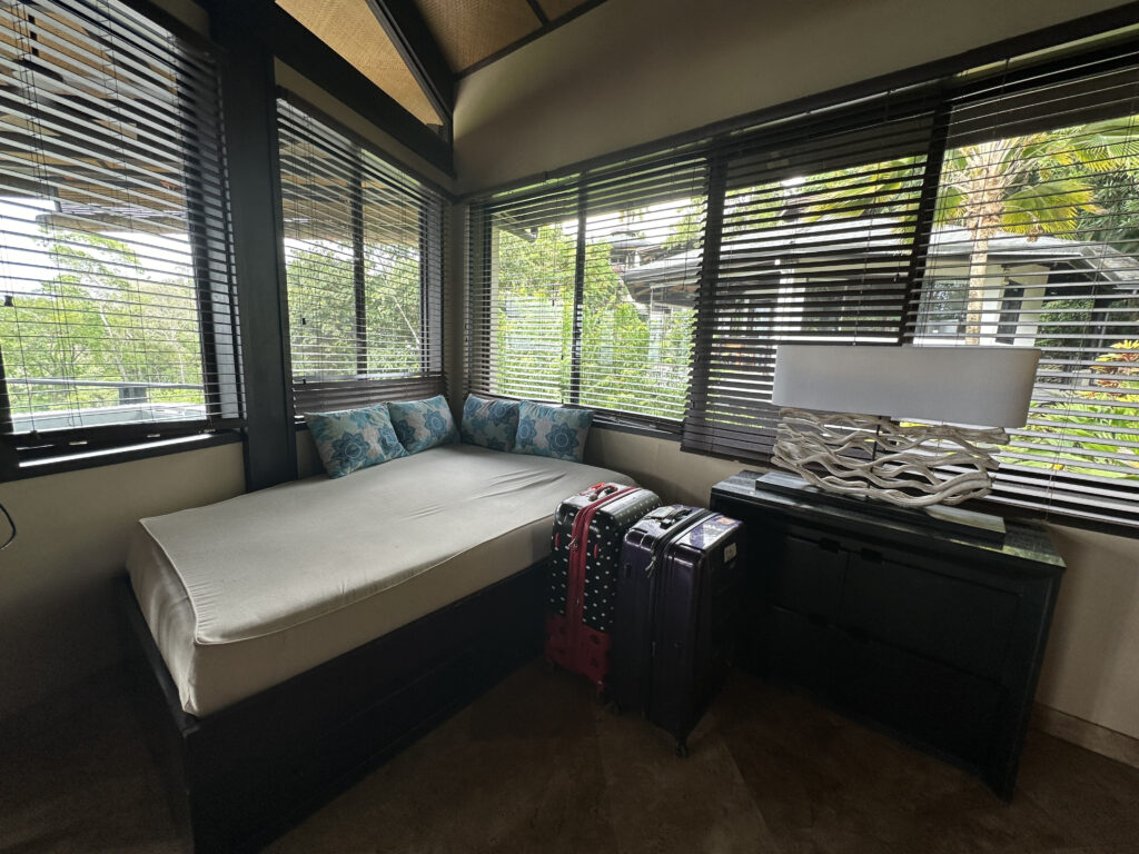 a room with a bed and luggage