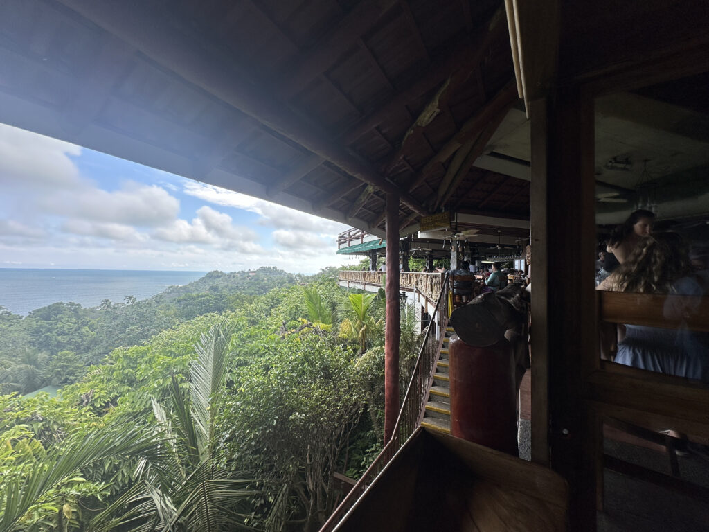 a building with a view of the ocean and trees