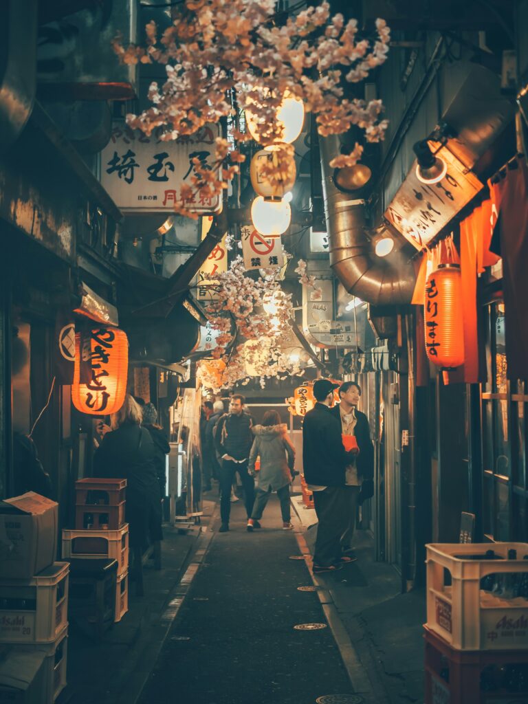 a group of people walking in a narrow alley