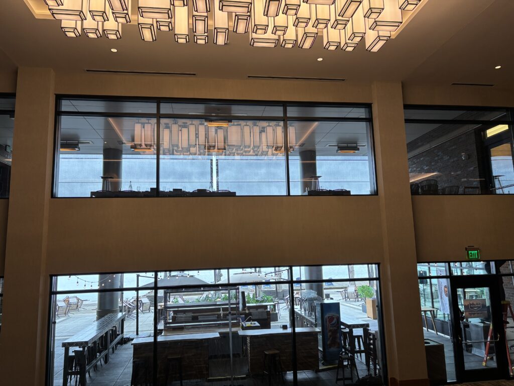 a large glass wall with a large window