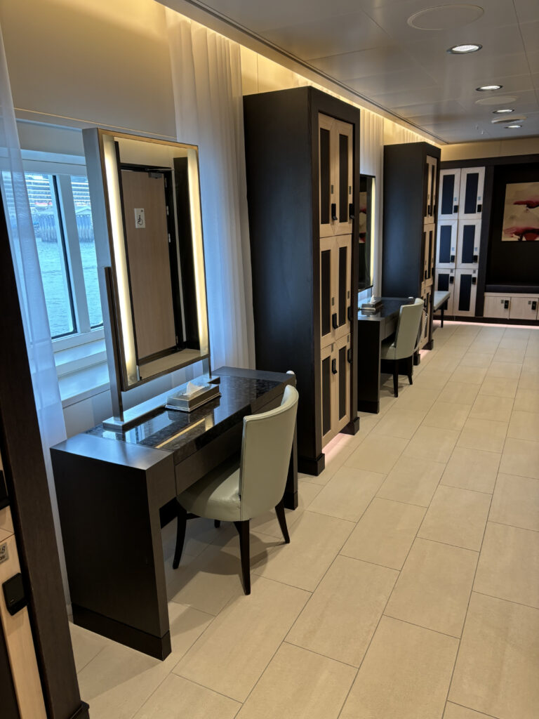 a room with a mirror and cabinets