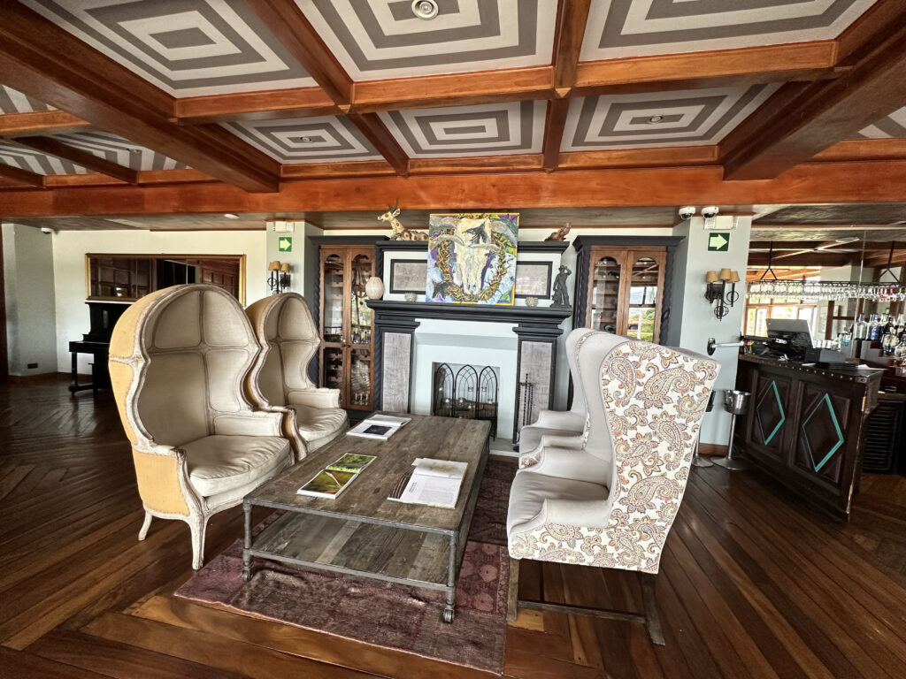 a room with chairs and a fireplace