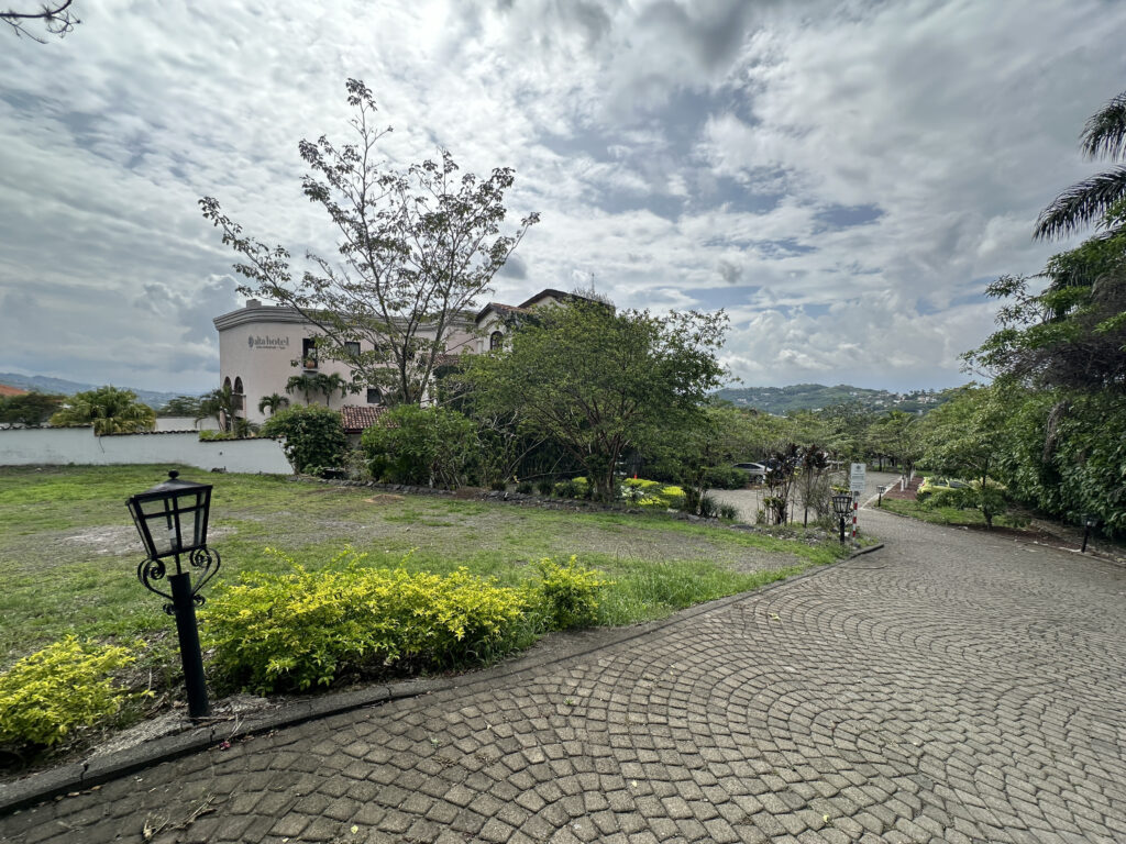 a stone path with a building in the background
