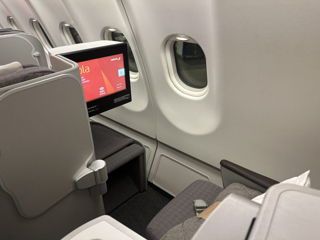 a screen on the side of an airplane