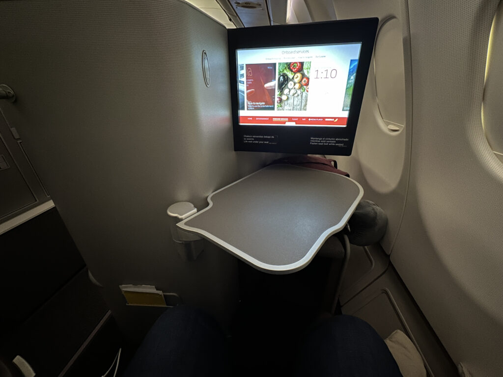 a tv on a table in an airplane