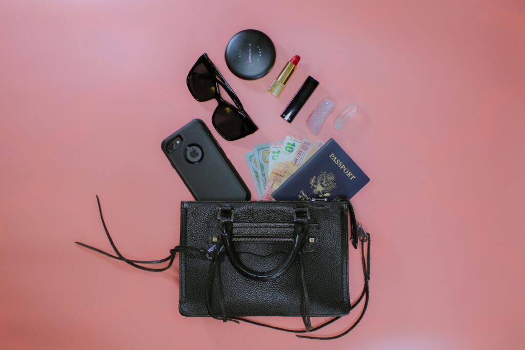 a purse with a phone and other items