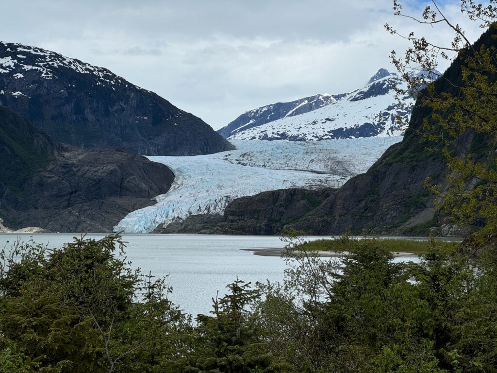 a glacier next to a body of water