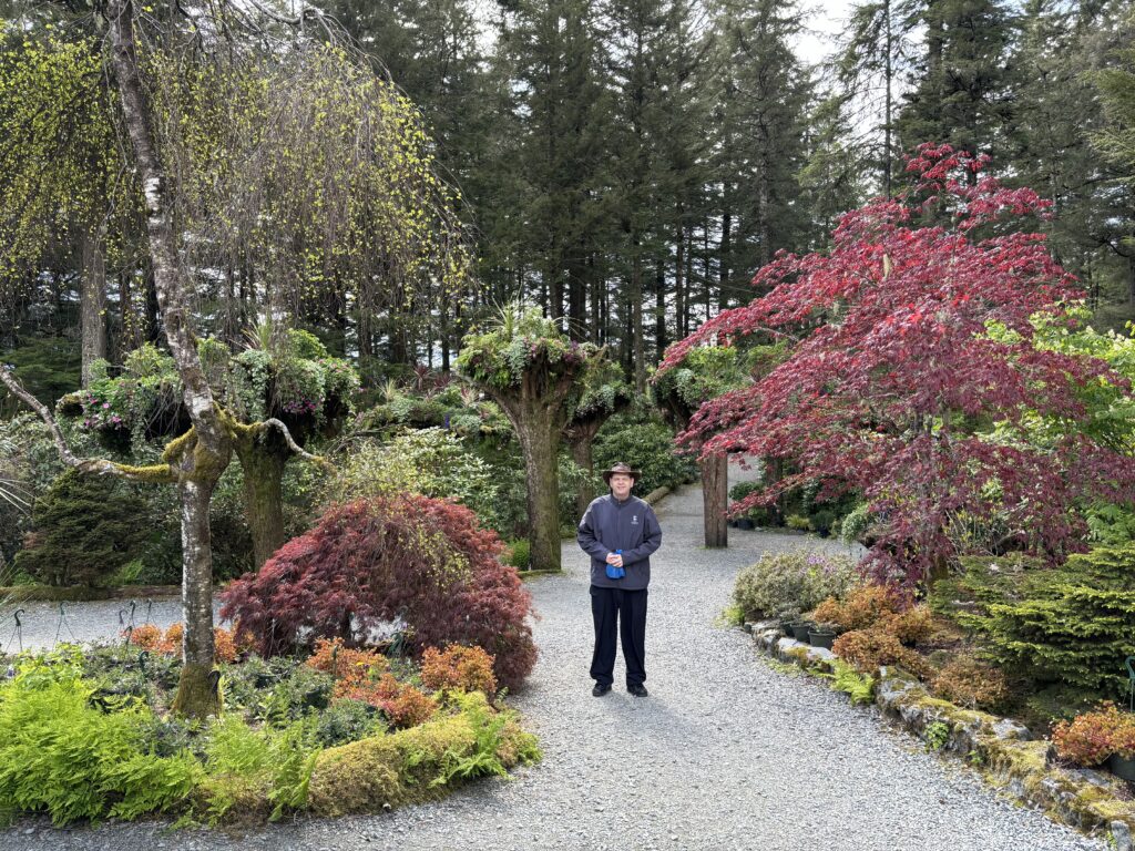 a man standing in a garden