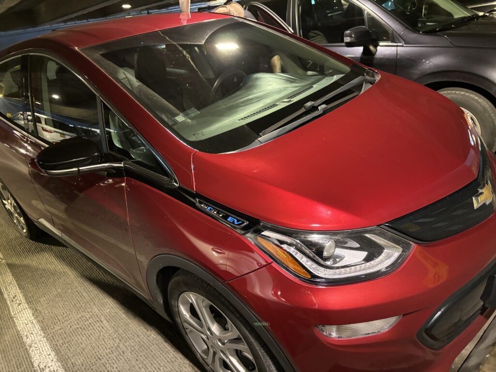 a red car parked in a parking lot