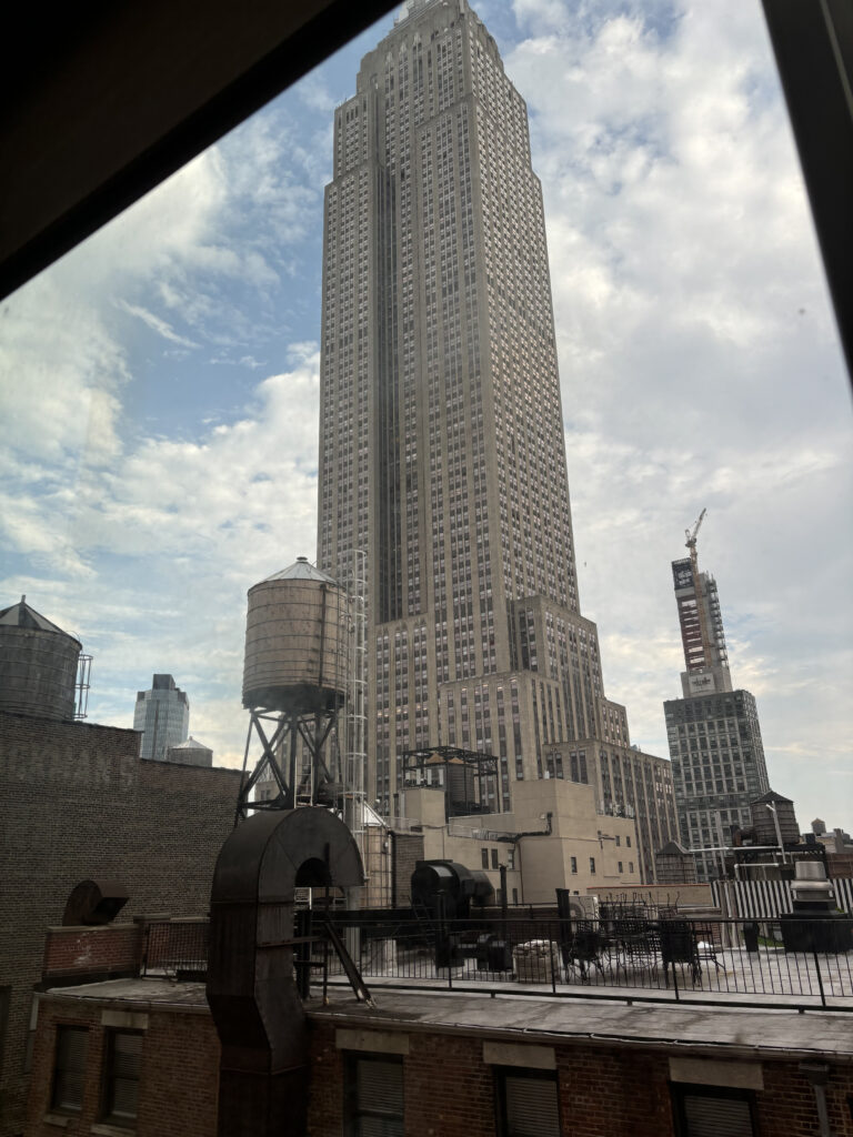 a tall building with a water tank in the background