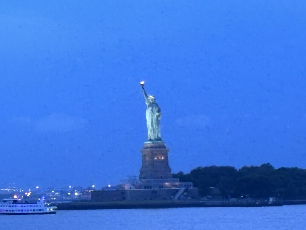 a statue of liberty with a torch on top of it