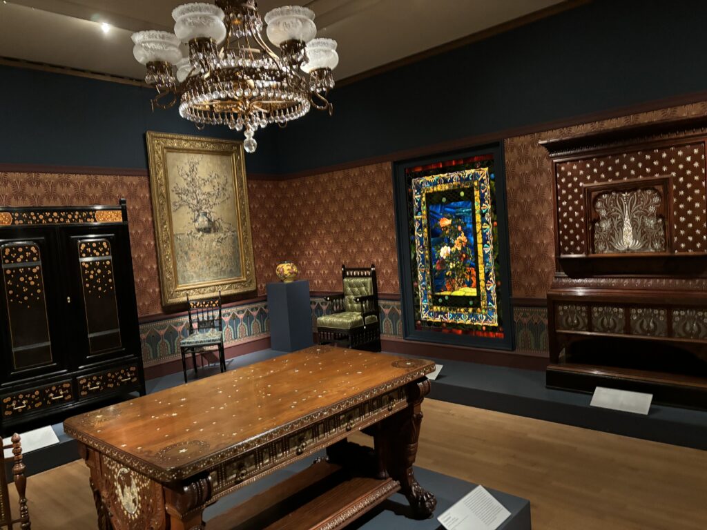 a room with a chandelier and a table