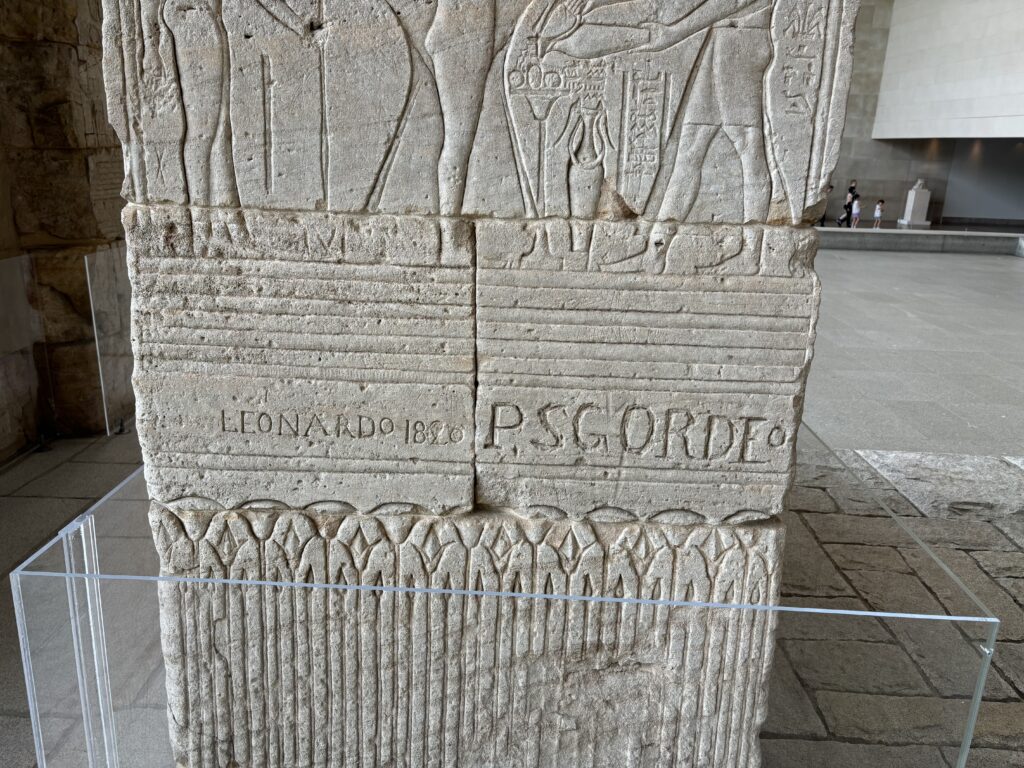 a stone pillar with carvings
