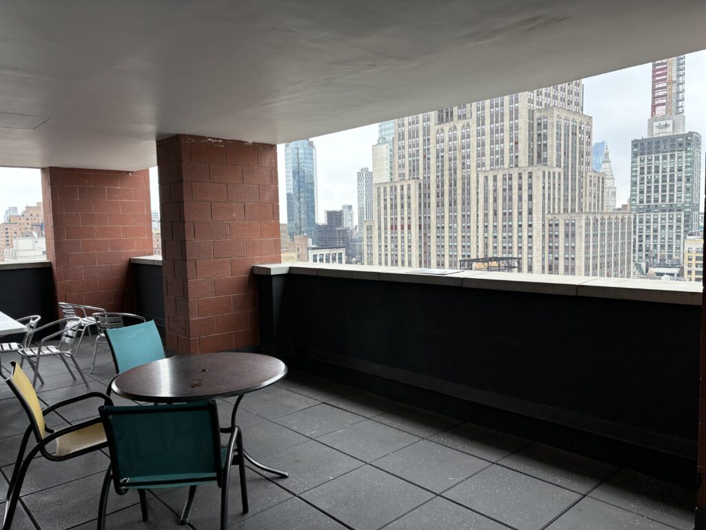 a table and chairs on a rooftop