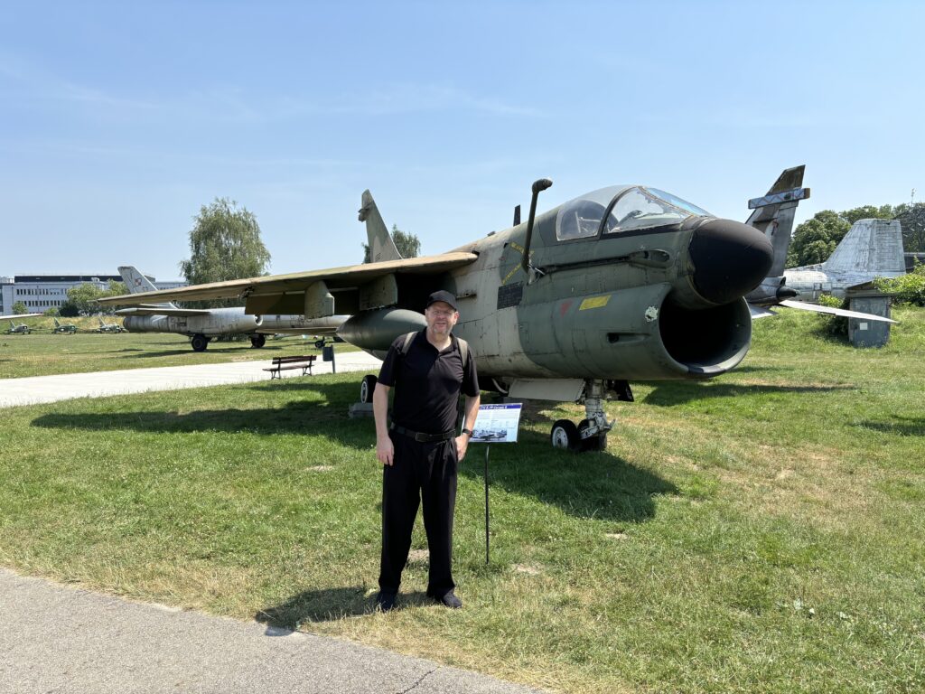 a man standing in front of an airplane
