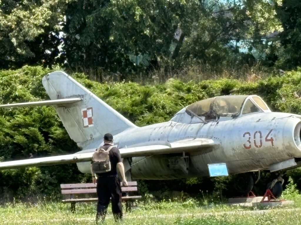 a man standing next to an airplane
